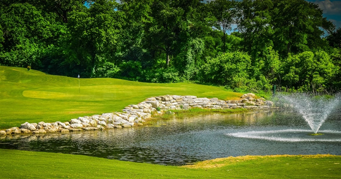 Tangle Ridge golf course green at golden hour